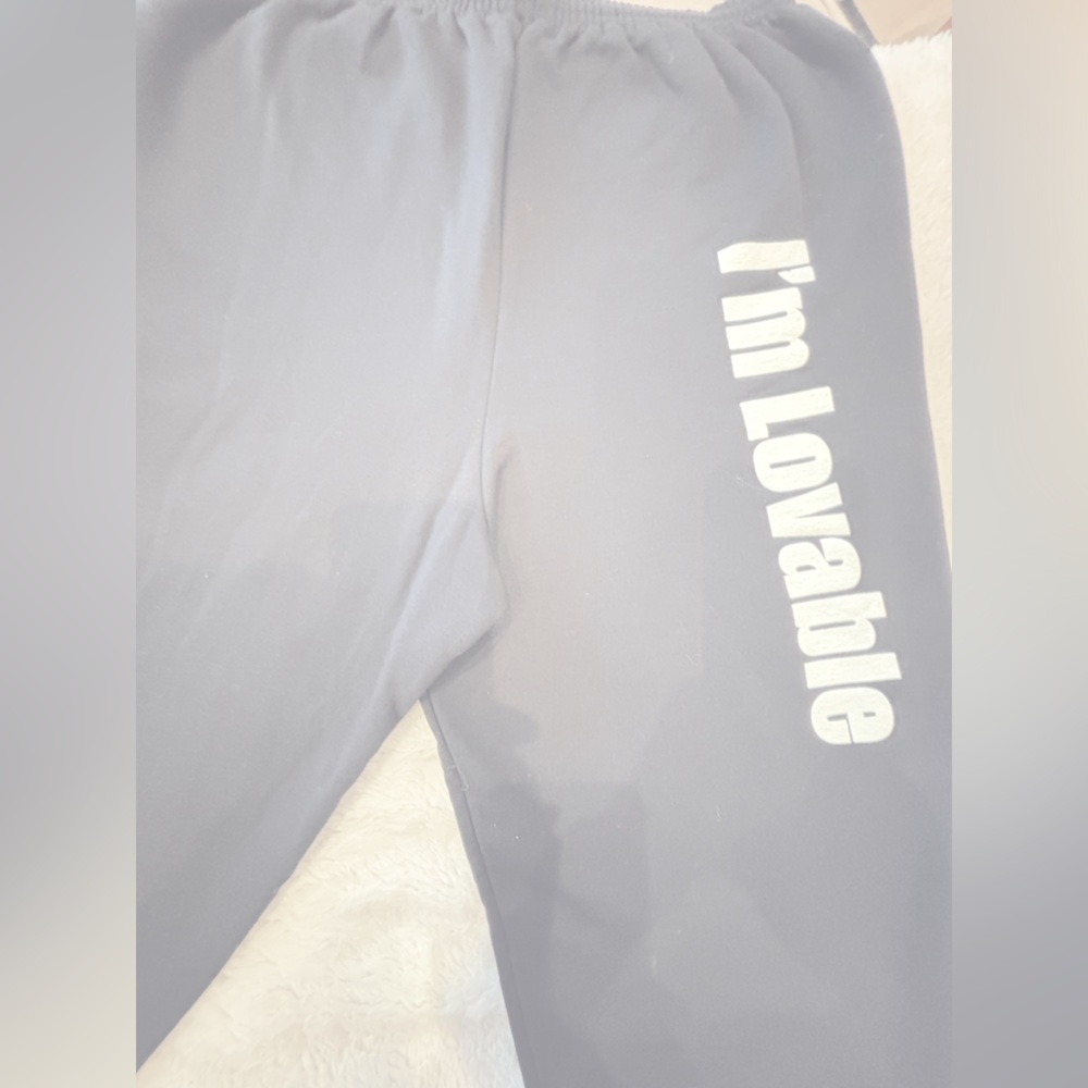 Black sweatpants match sweatshirt